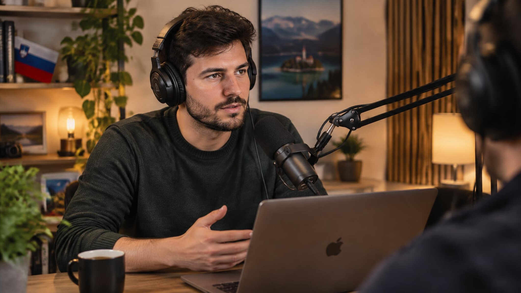 Podcaster recording an interview in a home studio